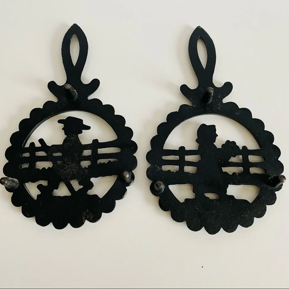 Vintage  Cast Iron Amish Woman and  man Trivets.